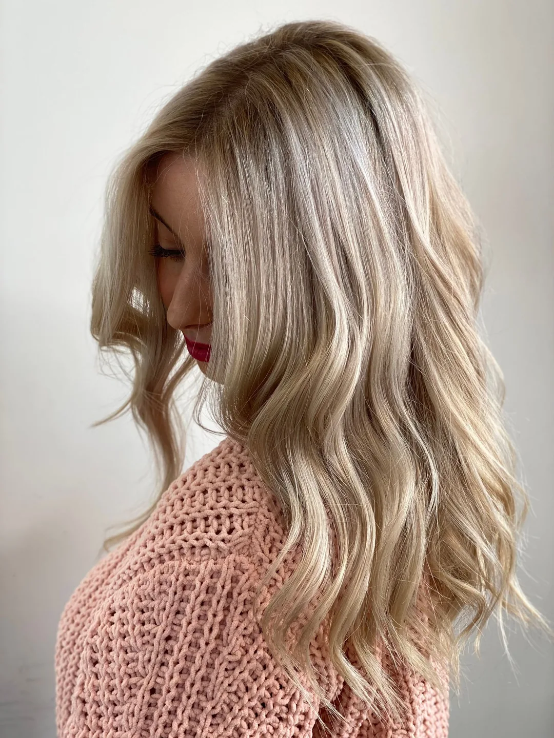 Long, softly blended blonde balayage waves
