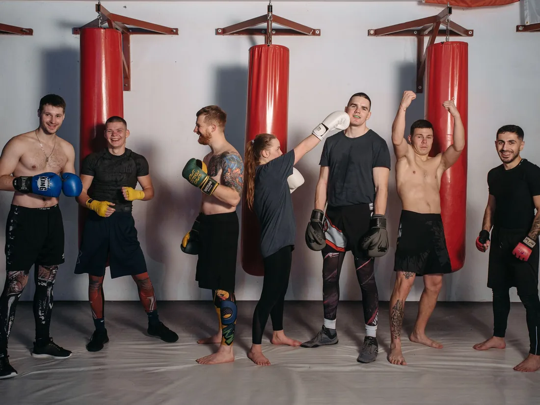 Members lined up in front of the heavy bags after a seminar