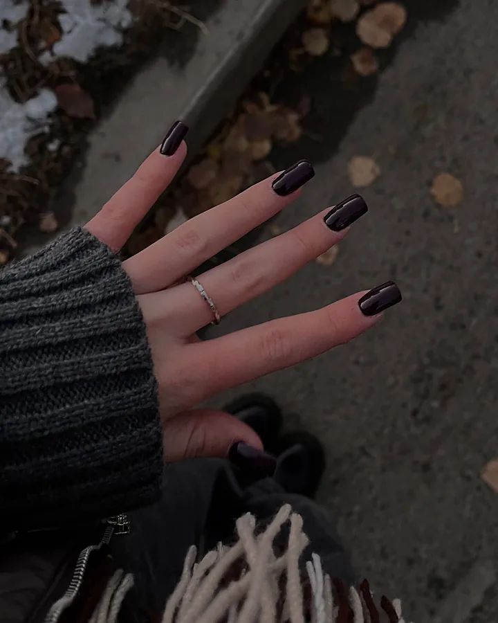 Glossy blackberry nails on a cold autumn day