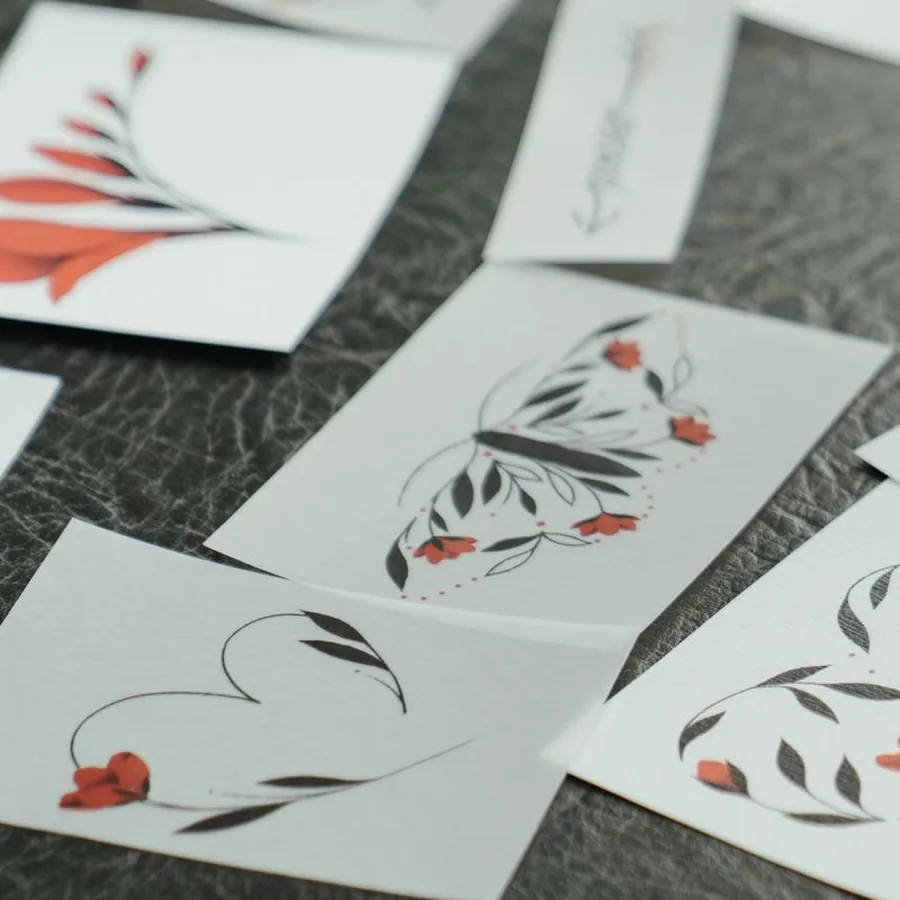 Red line flash: a branch of red flowers and a leafy butterfly