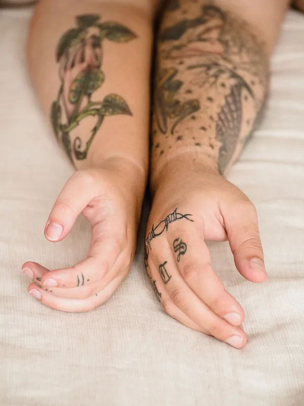 Healed fine line and colour pieces on two forearms
