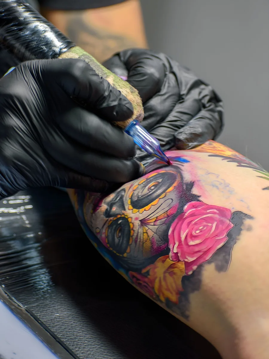 Neo-traditional rose and skull being coloured in by Marisol